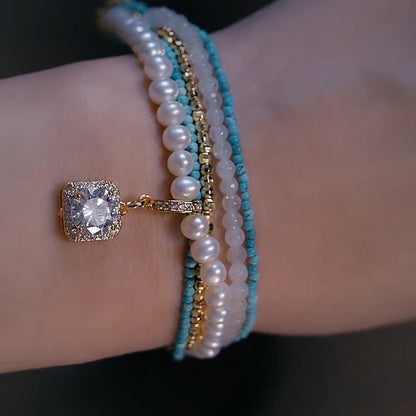 Handmade turquoise, pearl, and diamond bracelet