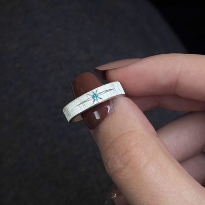 The Polaris Glacial Ice Band – Artisan Brushed Ring with Icy Blue Starburst