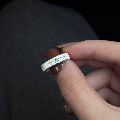 The Polaris Glacial Ice Band – Artisan Brushed Ring with Icy Blue Starburst