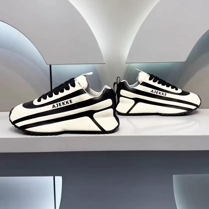 Black and white striped arch support athletic shoes