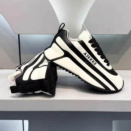 Black and white striped arch support athletic shoes