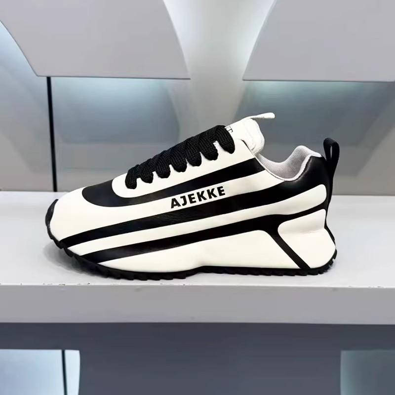 Black and white striped arch support athletic shoes