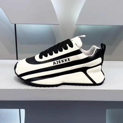Black and white striped arch support athletic shoes
