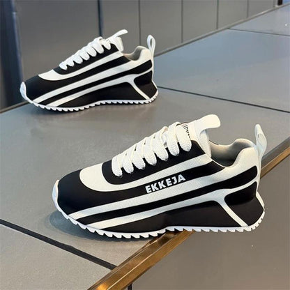 Black and white striped arch support athletic shoes